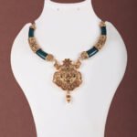 Temple Jewellery Necklace Set in Antique Gold with Green Accents by Khallaq