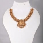 Lakshmi Temple Short Necklace Set in Antique Gold with Matching Jhumka Earrings by Khallaq