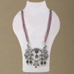 Handcrafted Silver Replica Statement Necklace with pink bead strands and oxidised silver peacock pendant from Khallaq Chand Collection.