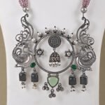 Handcrafted Silver Replica Statement Necklace with pink bead strands and oxidised silver peacock pendant from Khallaq Chand Collection.