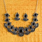 Silver replica necklace set featuring black faceted stones with matching earrings from Khallaq Chand Collection.