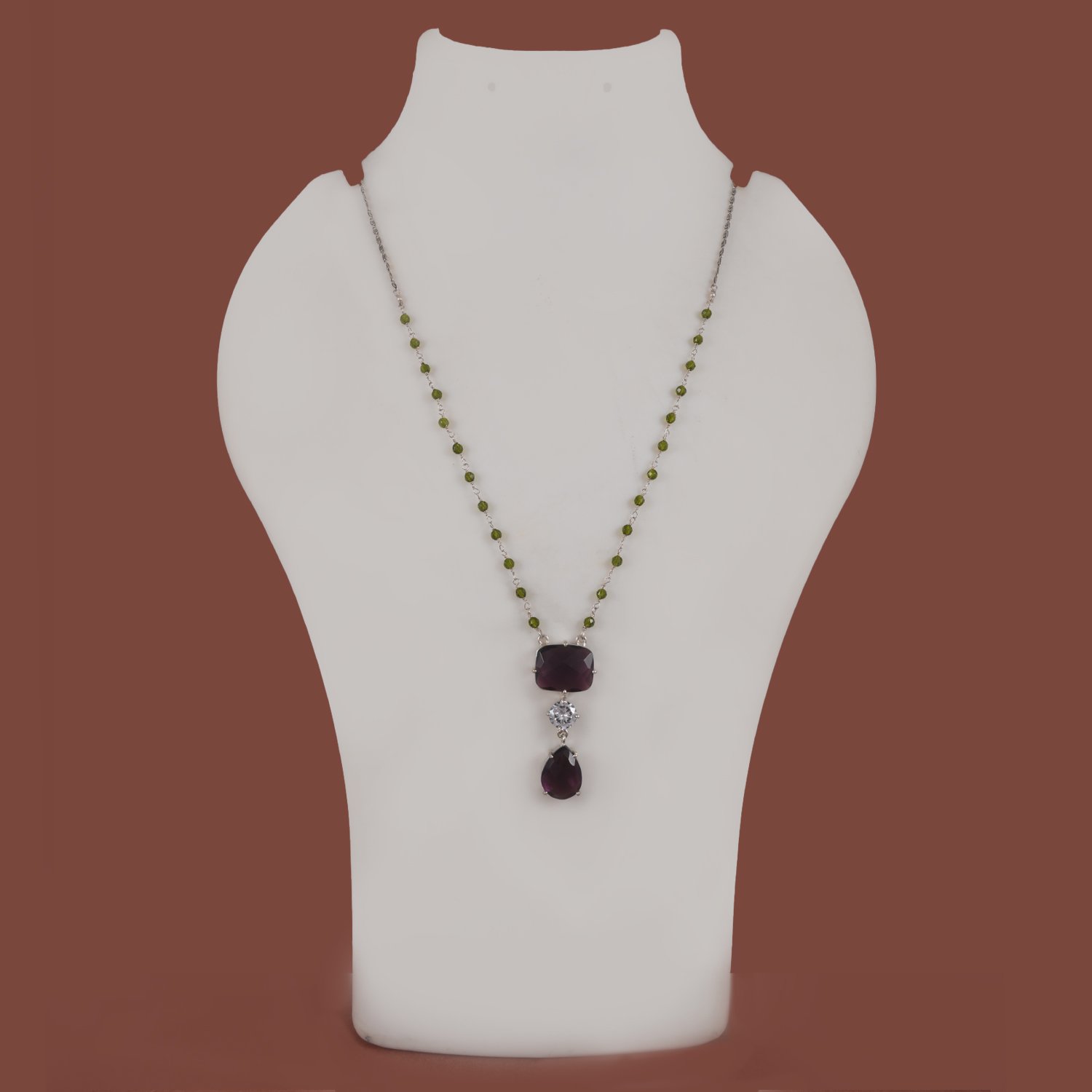95 Silver replica chain pendant available in maroon, blue & light green, and purple stone variants from Khallaq Chand Collection.