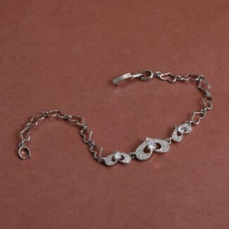 Saadgi anti tarnish silver heart bracelet for women with crystal heart motifs and adjustable chain by Khallaq.